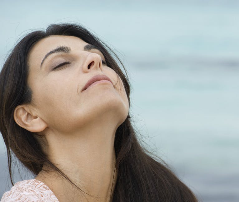 Otrivin-what-is-xylometazoline Woman with clear sinuses lifts head to breath in fresh air