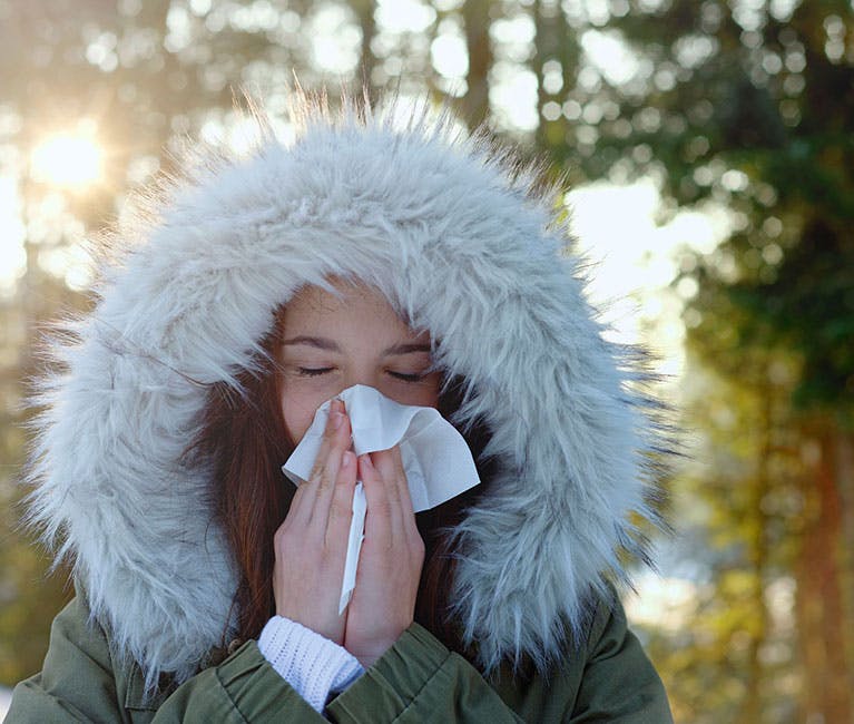 Man suffering nasal congestion massages his sinuses
