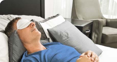 man sleeping with eye-mask