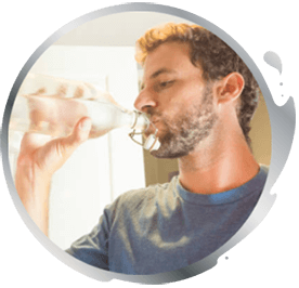 Man drinking from a bottle of water Man drinking from a bottle of water