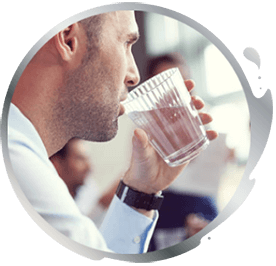 Man drinking a glass of water Man drinking a glass of water