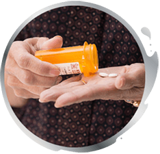 A man pouring pills out of bottle into his hand A man pouring pills out of bottle into his hand