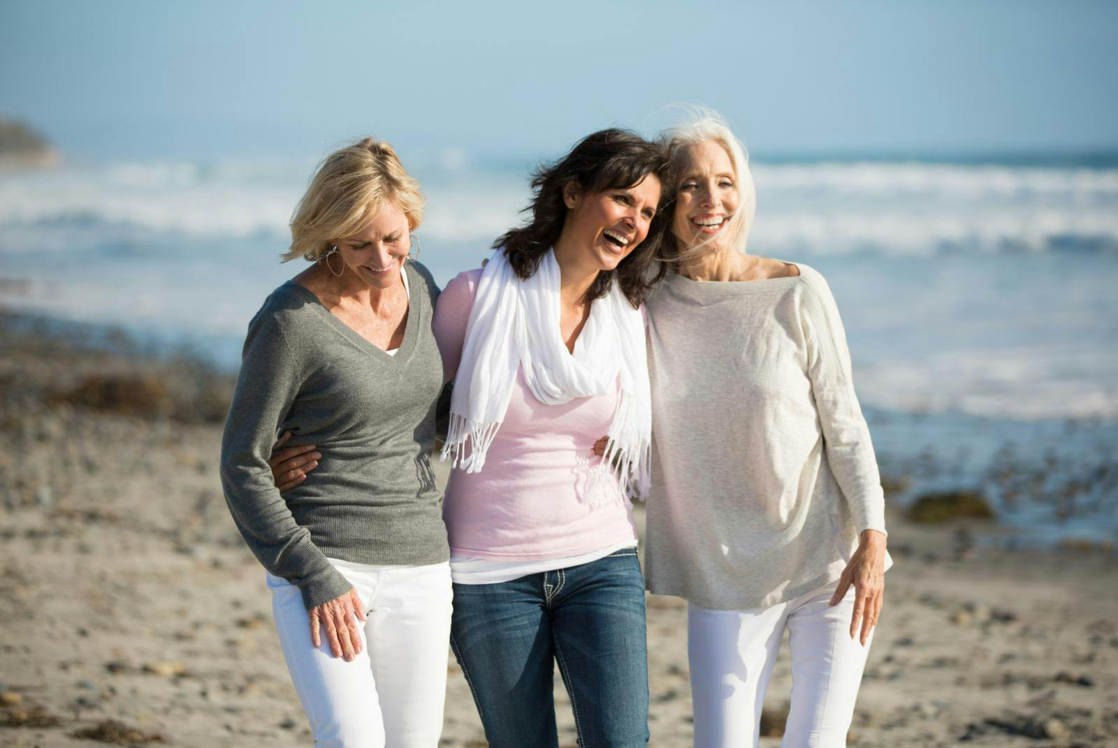 Three elderly ladies walking on the beach. Three elderly ladies walking on the beach.