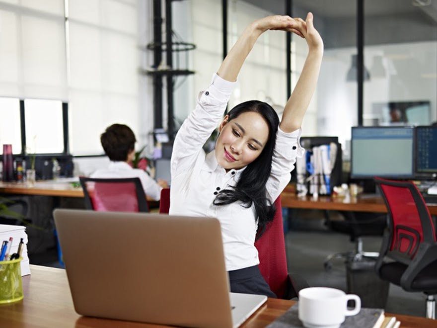 Lady_stretching_in_office Lady_stretching_in_office