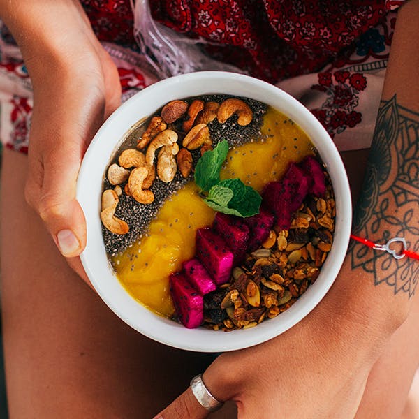 Woman holding acai bowl Woman holding acai bowl