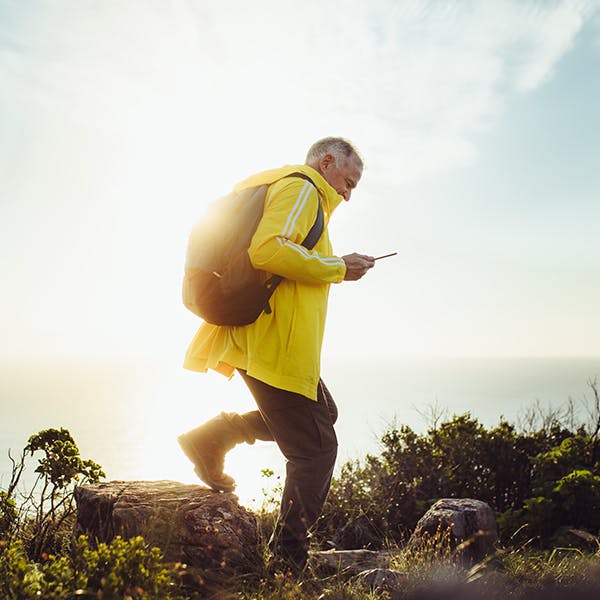 Person with a backpack hiking outside Person with a backpack hiking outside
