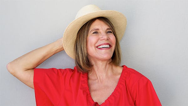 healthy middle-aged woman laughing healthy middle-aged woman laughing