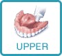 putting adhesive cream on upper dentures