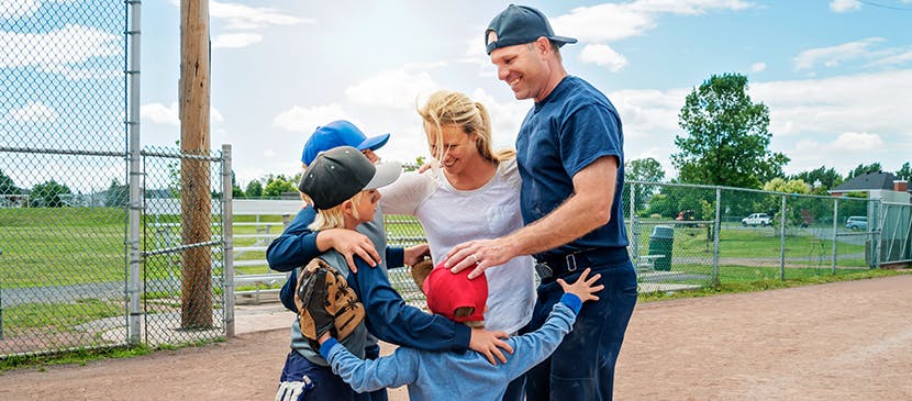 allergy free baseball family hugging outside