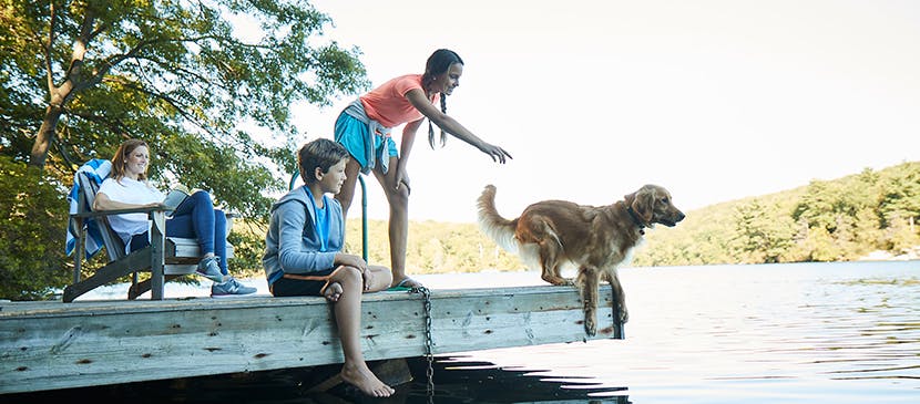 kids with allergies playing with their dog outside
