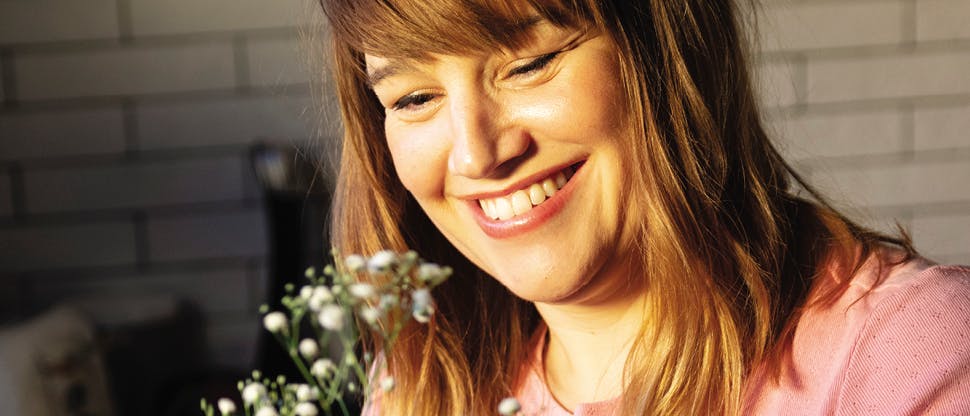 Image of woman holding flowers