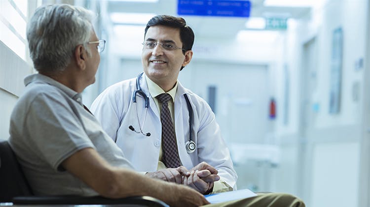 Man discussing with physician
