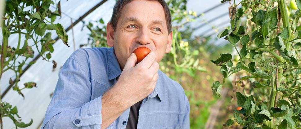 108346199 Man eating orange