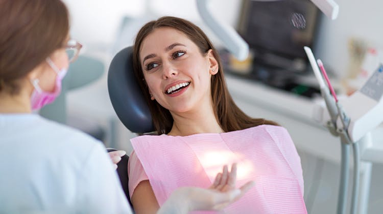 Patient talking with dentist