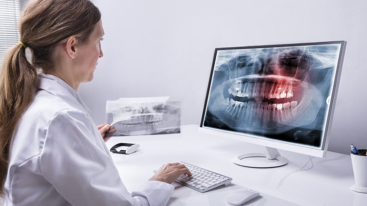 958332936 Dentist at desk