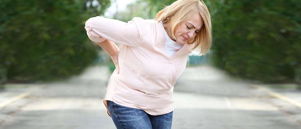 Woman holding back