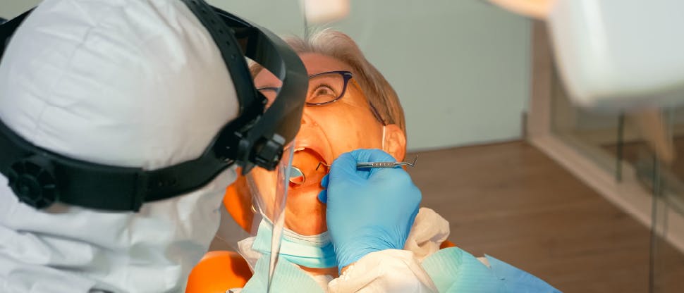 SM12415 GSK Portal Imagery - pronamel Dentist explaining gum disease to dental patient