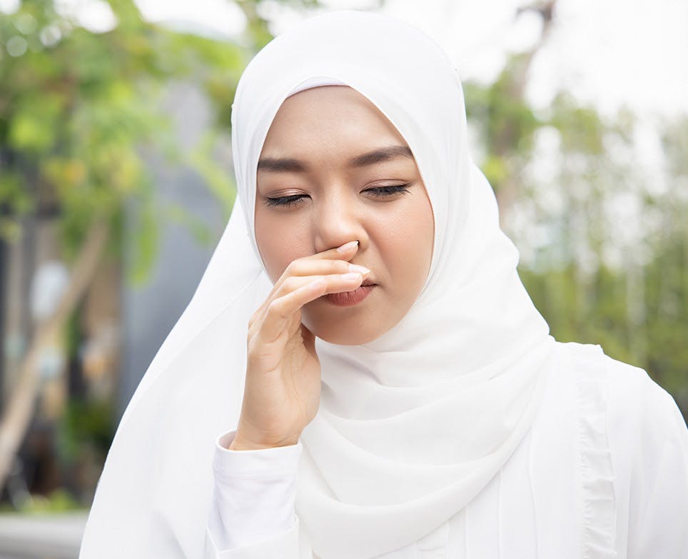 A woman coughing A woman coughing