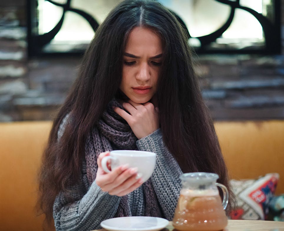 A women with a sore throat A women with a sore throat