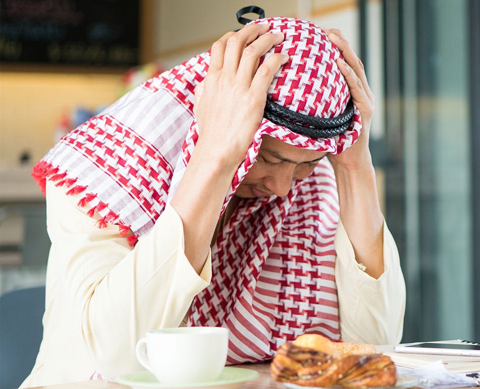 A man suffering from a headache A man suffering from a headache