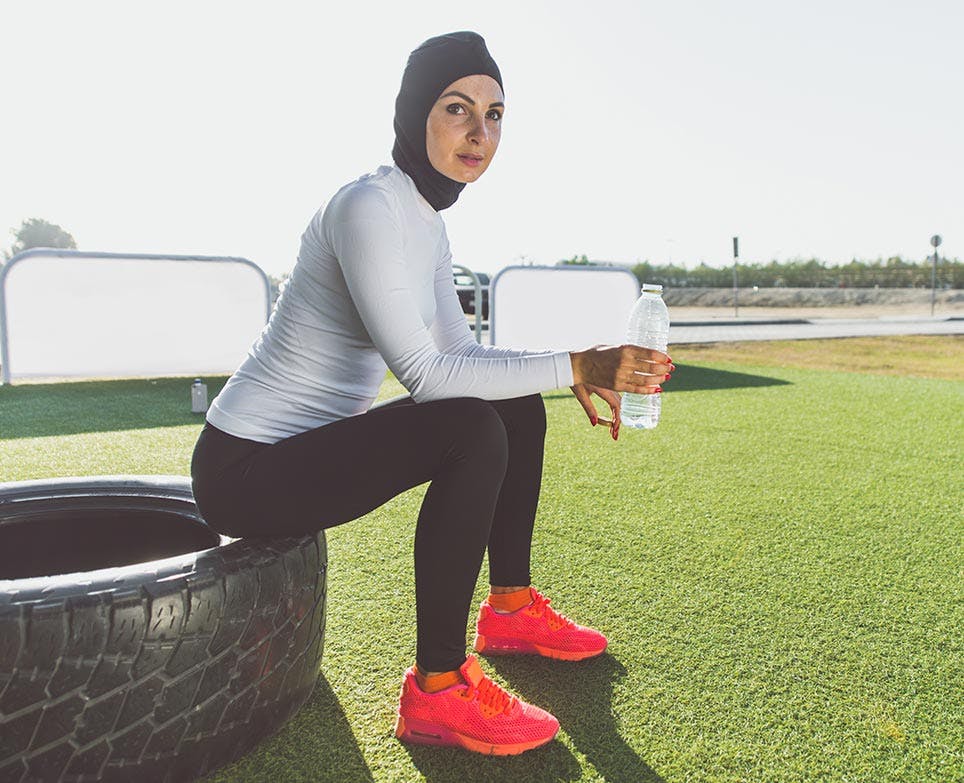 A woman resting post-workout A woman resting post-workout