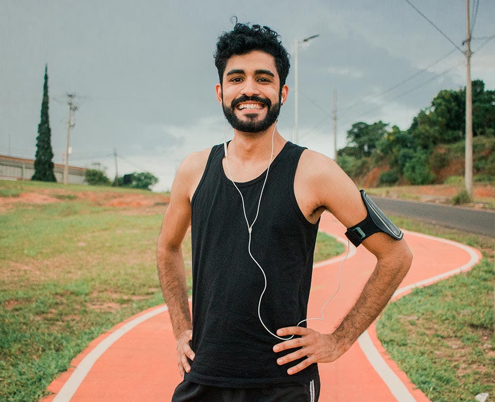 An athlete happily standing An athlete happily standing