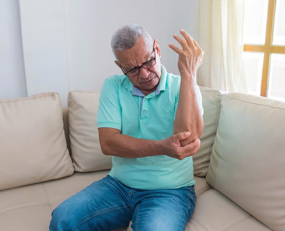 A man dealing with joint pain A man dealing with joint pain