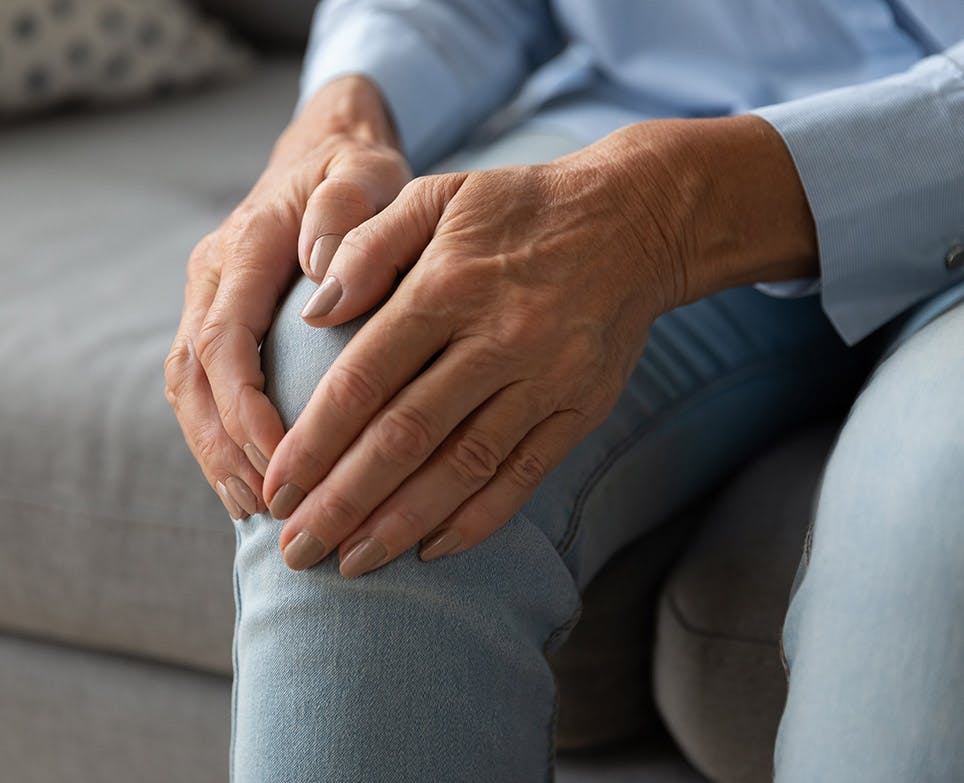 A person dealing with knee pain A person dealing with knee pain
