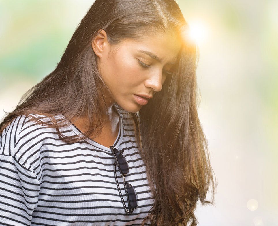 A woman dealing with menstrual cramps A woman dealing with menstrual cramps