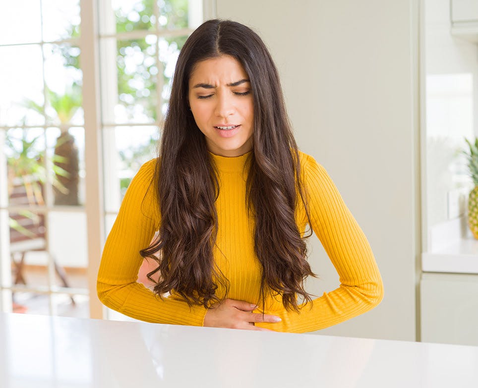 A woman dealing with period pain A woman dealing with period pain