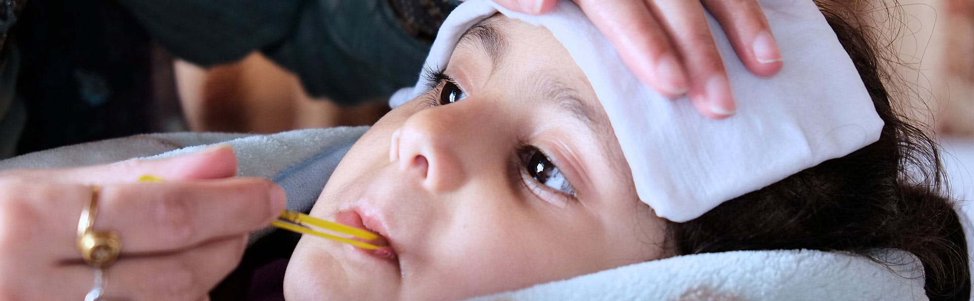 A little girl with a fever A little girl with a fever