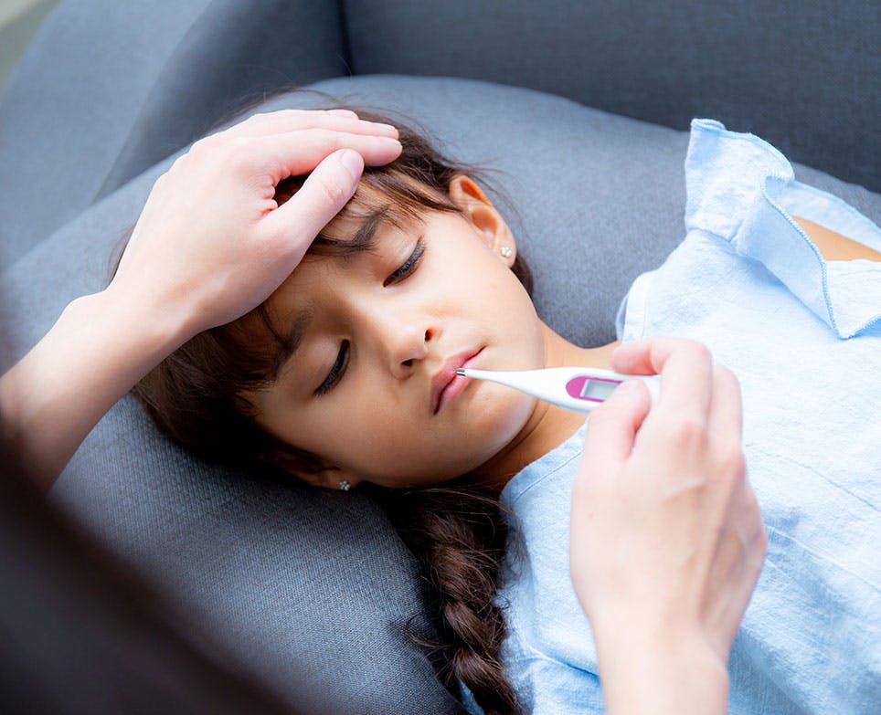 A little girl with a fever A little girl with a fever