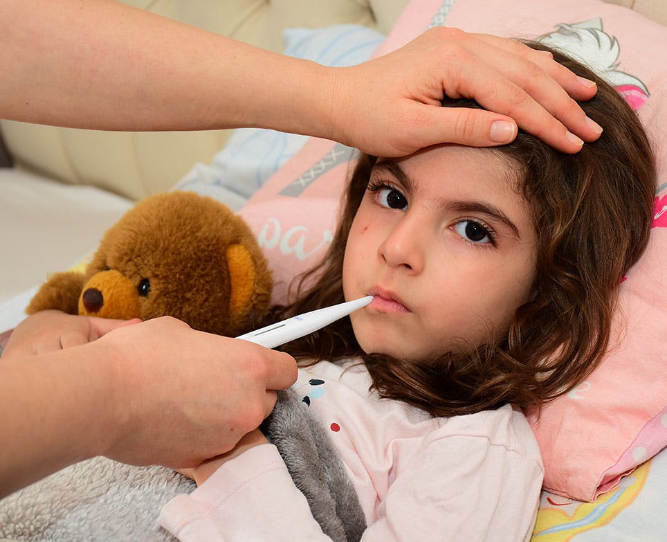 A little girl with a fever A little girl with a fever
