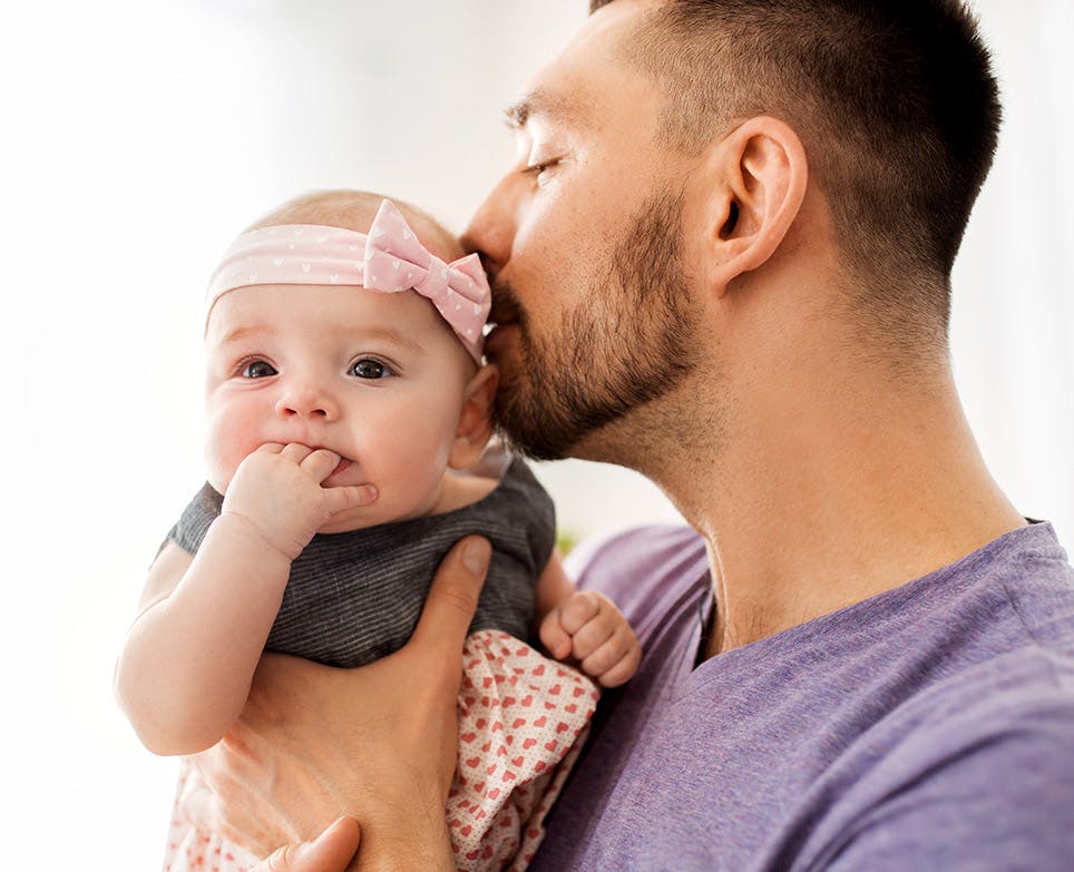 A father kissing his baby girl A father kissing his baby girl