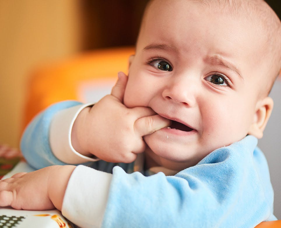 A baby dealing with toothaches A baby dealing with toothaches