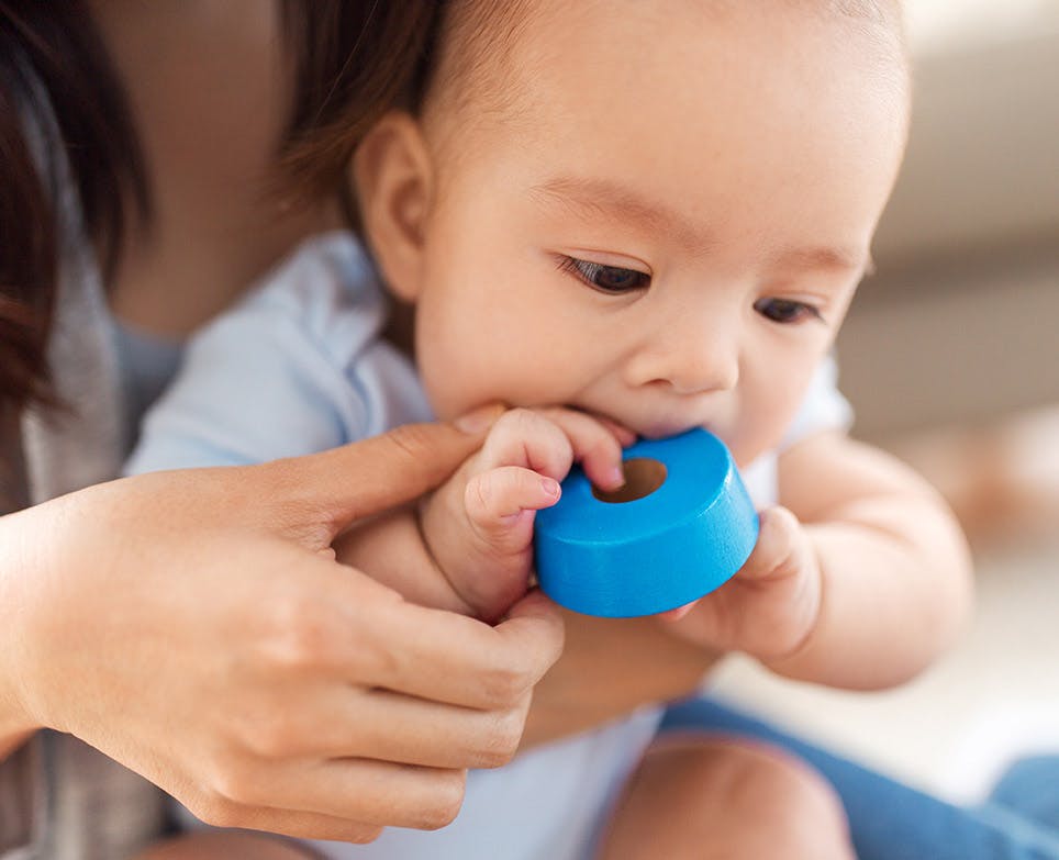 Baby biting a duct tape. Baby biting a duct tape.