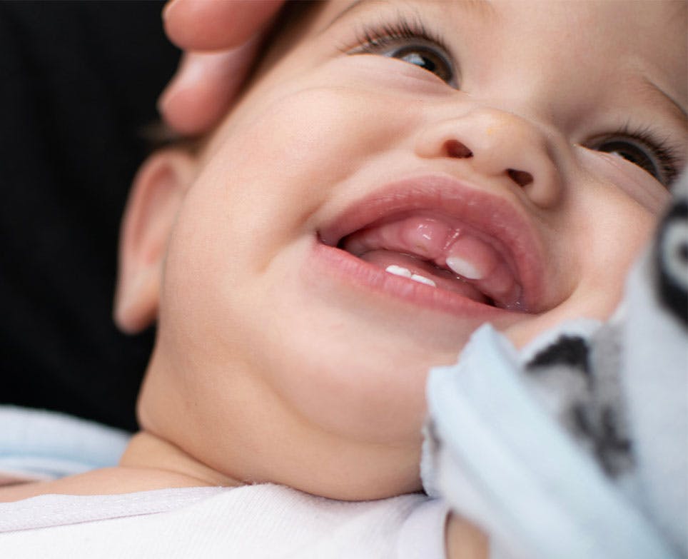 Baby smiling, in the process of teething. Baby smiling, in the process of teething.