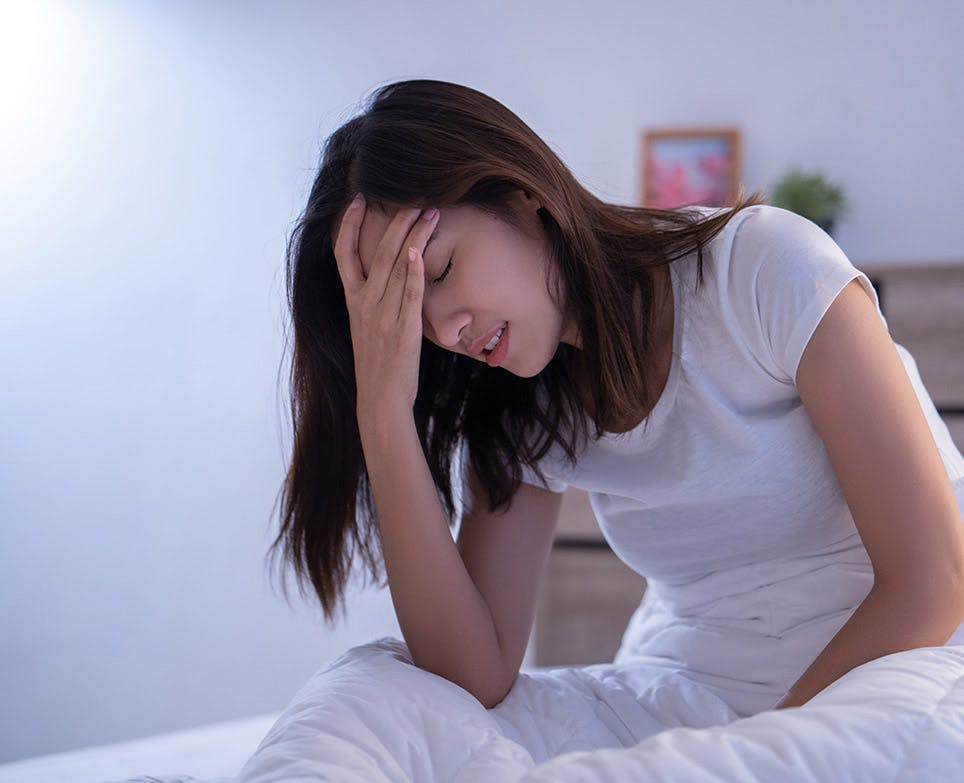 Young woman holding her aching head. Young woman holding her aching head.