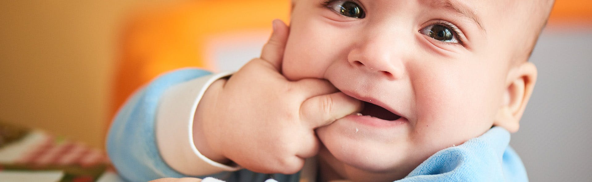 Baby with his fingers in his mouth. Baby with his fingers in his mouth.