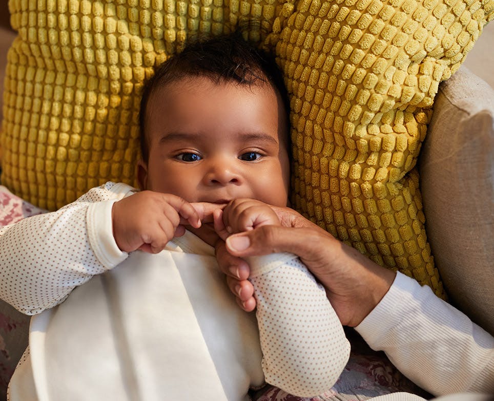 Baby sucking his father's finger. Baby sucking his father's finger.