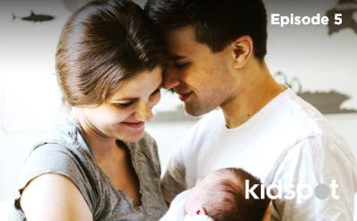 Young couple holding their baby together