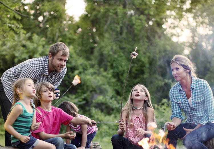 Family Roasting Marshmallows Over Campfire Family Roasting Marshmallows Over Campfire
