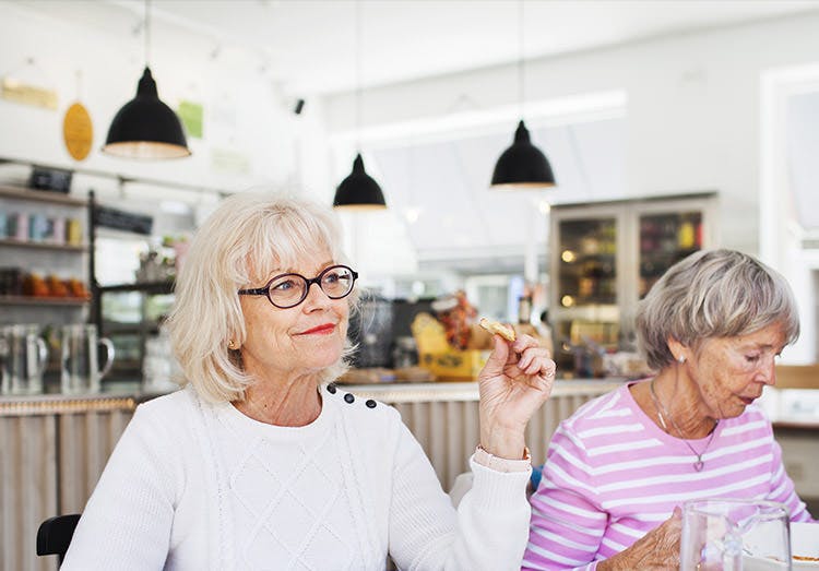 Two elderly woman having coffee together Two elderly woman having coffee together