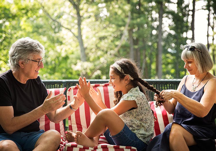 Elderly Man Playing A Clapping Game With His Granddaughter Elderly Man Playing A Clapping Game With His Granddaughter