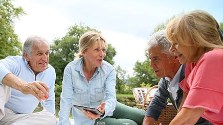 Group Of Senior People Enjoying Picnic On Sunny Day Group Of Senior People Enjoying Picnic On Sunny Day