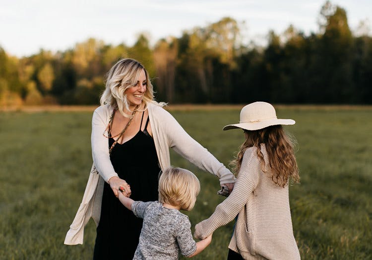 Mother Dancing With Her Daughters In A Field Mother Dancing With Her Daughters In A Field