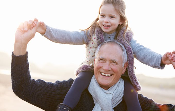 Grandfather And Granddaughter Walking On Winter Beach Grandfather And Granddaughter Walking On Winter Beach