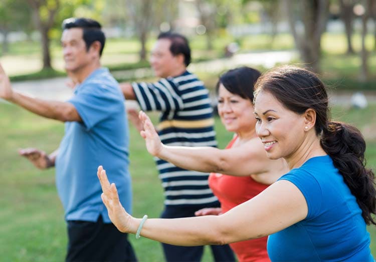 Group of seniors exercising outdoors Group of seniors exercising outdoors