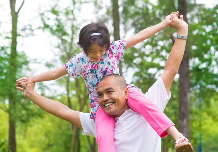 Father Playing With His Daughter In Park Father Playing With His Daughter In Park