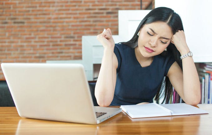 Woman experiencing headache Woman experiencing headache